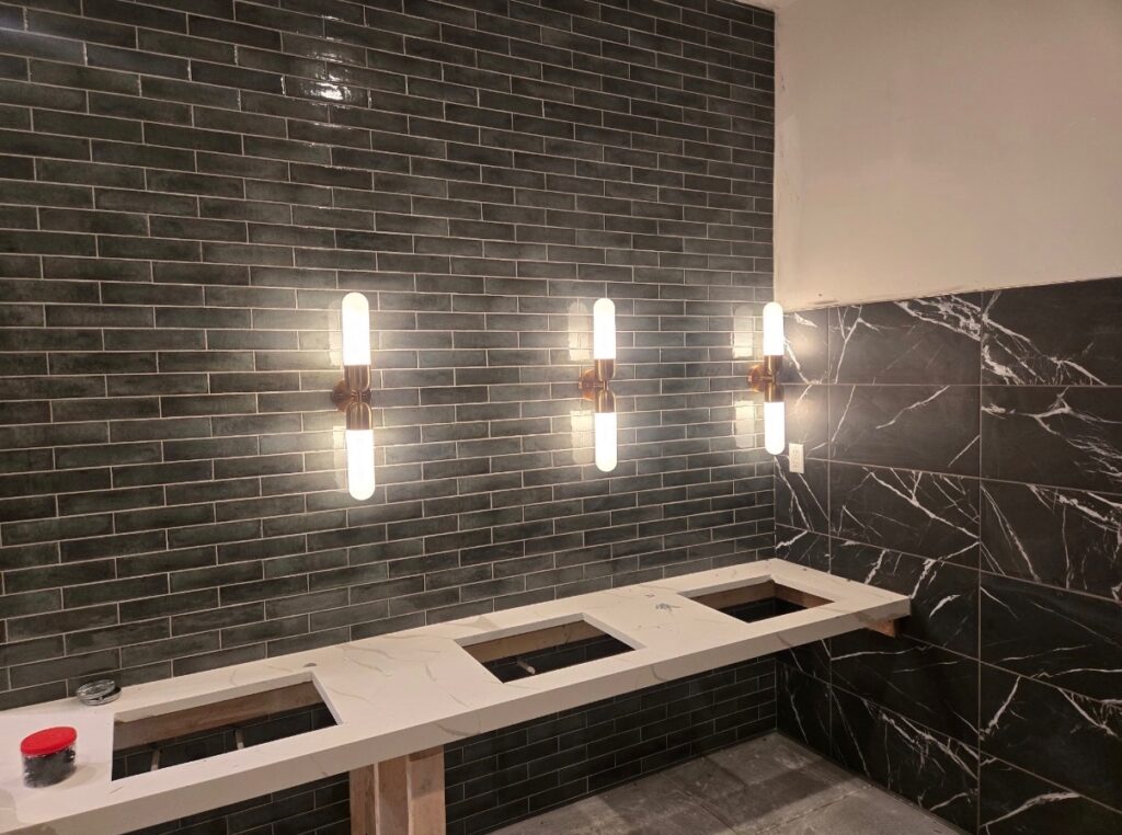 Client-provided photograph of installed wall lighting at a property