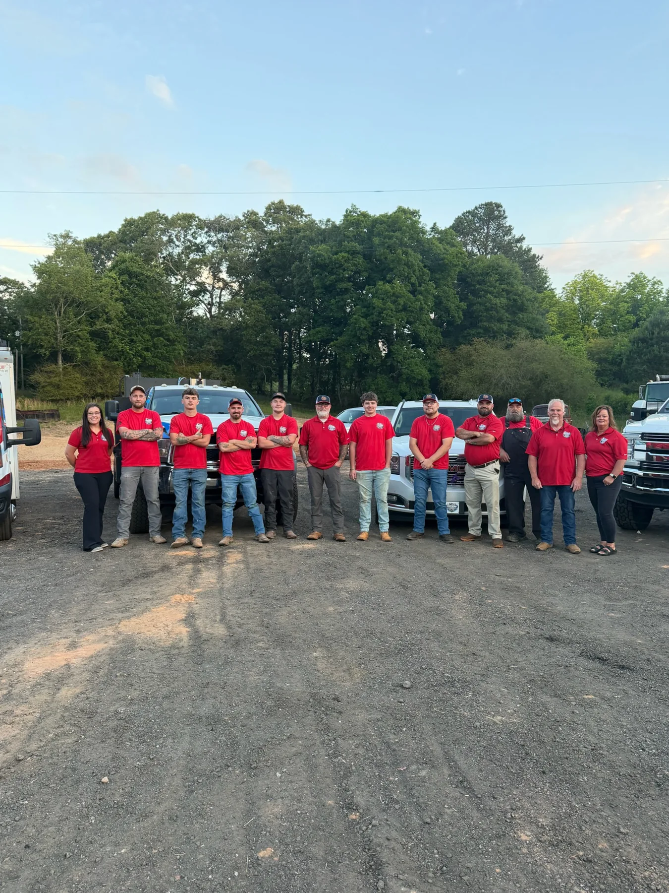 Freedom’s team together in front of their service trucks