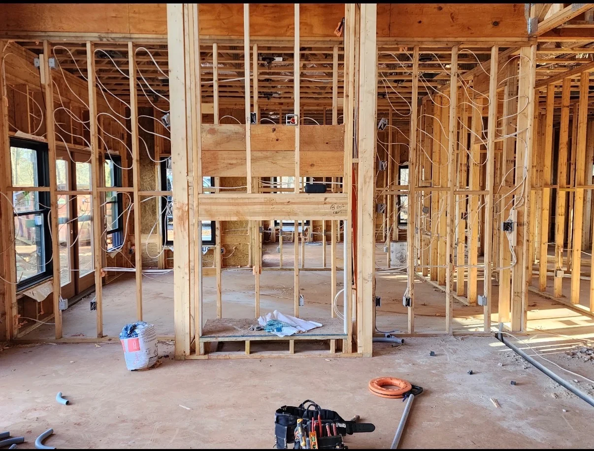 Electrical boxes and wiring within residential wall framing.