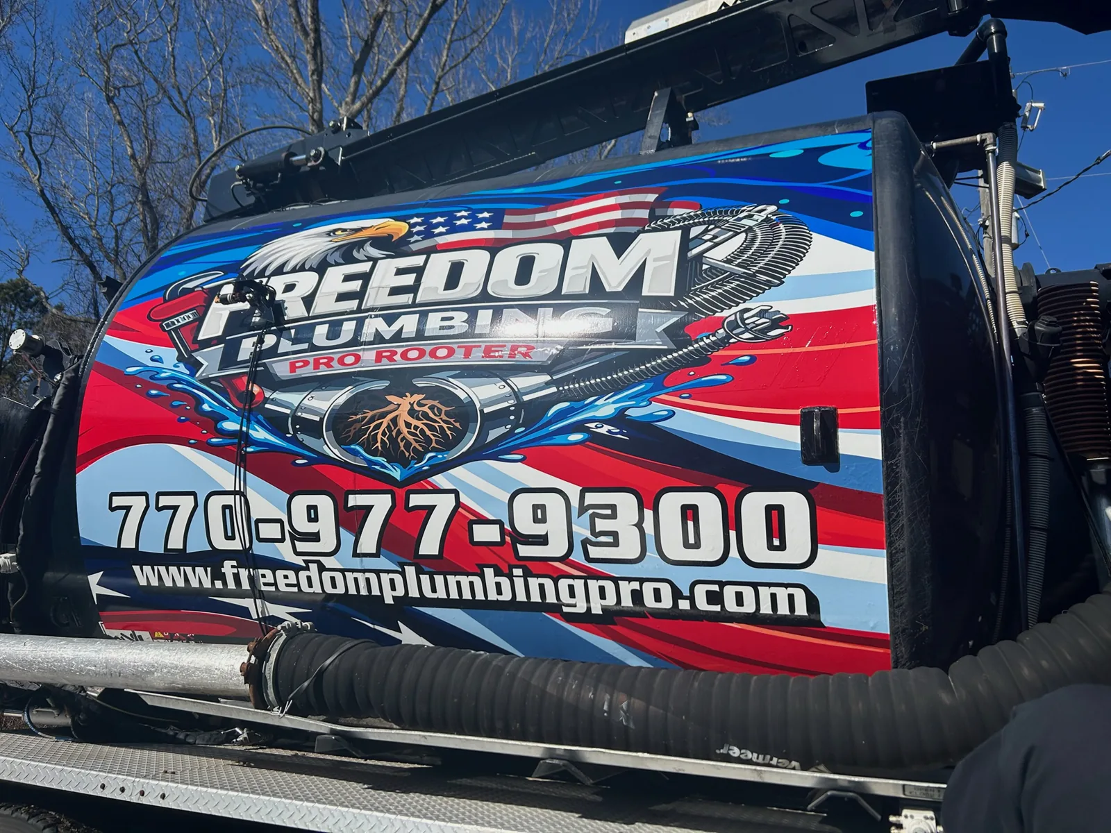 Close view of the branded side of a Freedom service truck.