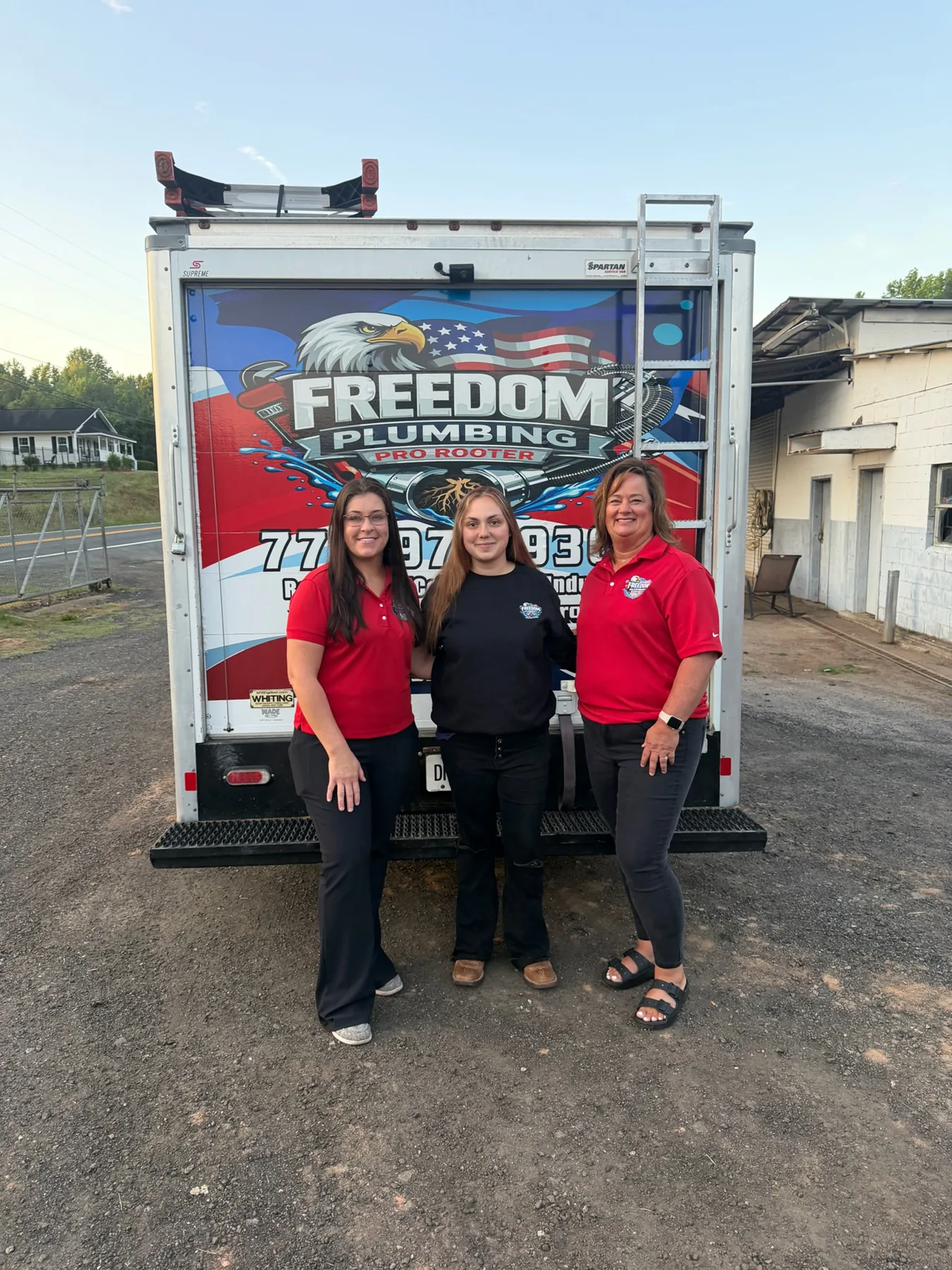 About Freedom 3 People in Freedom apparel beside service vehicles.