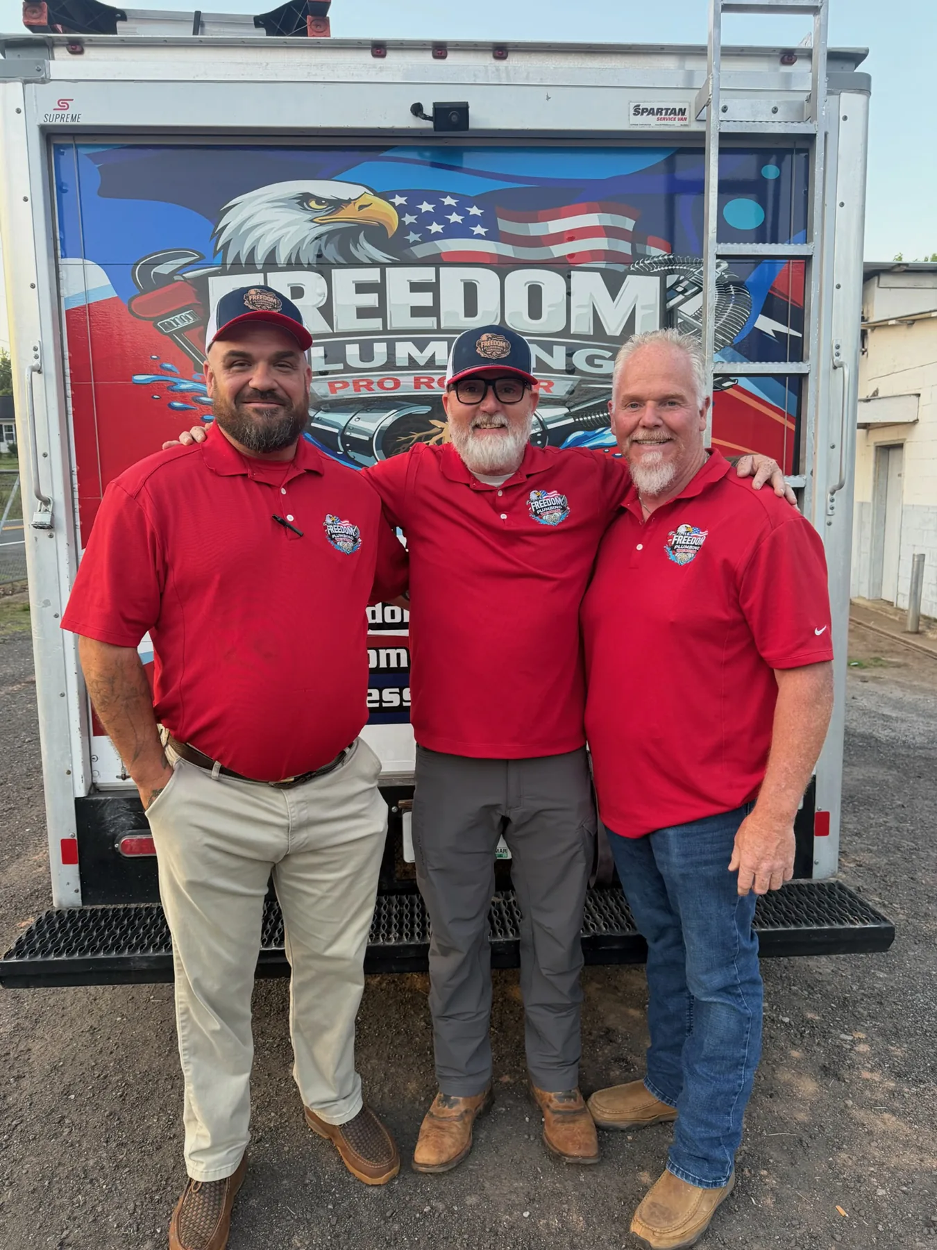 About Freedom 4 People in Freedom apparel beside service vehicles.