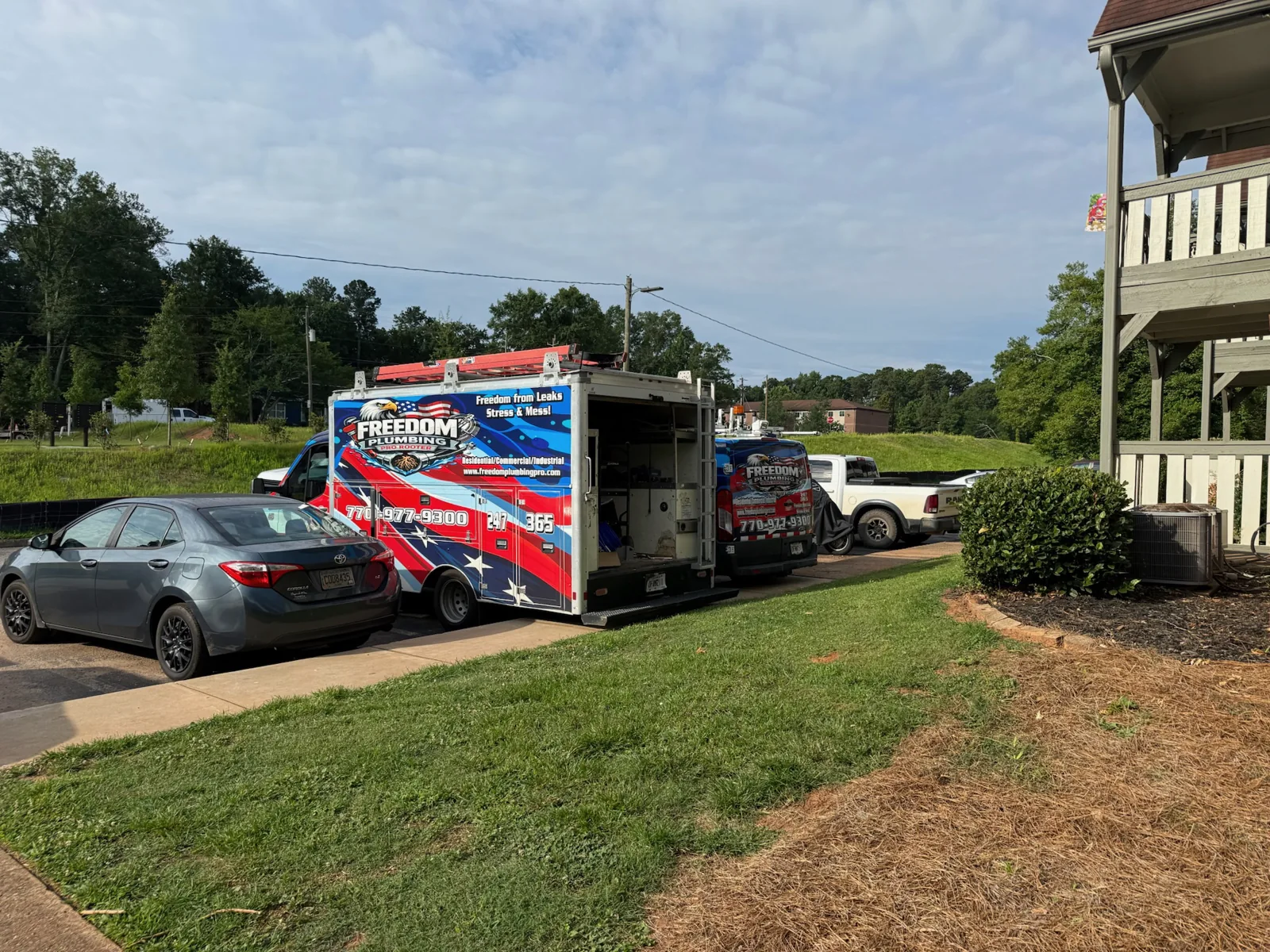 Freedom service truck parked beside a residential property.