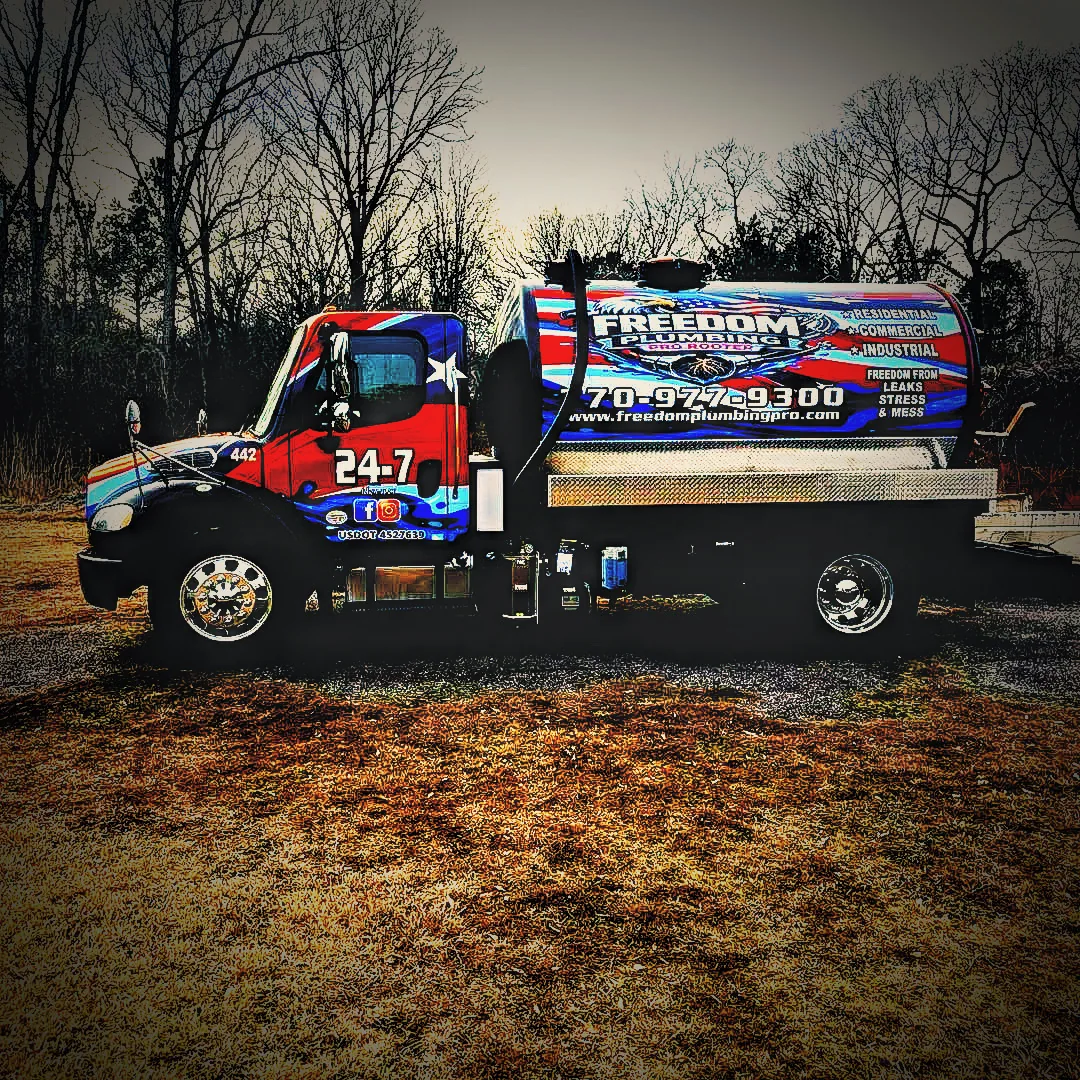 Freedom-branded pump truck parked outdoors.